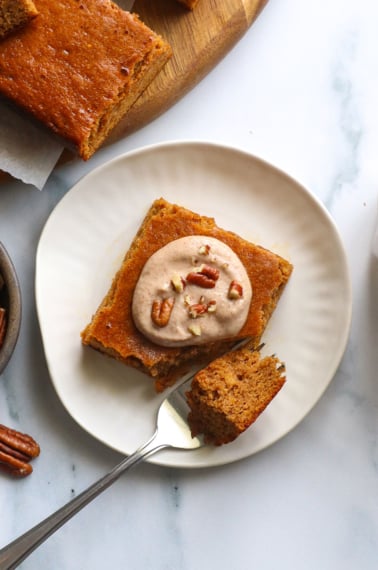 maple pecan glaze on a pumpkin bar on a plate.