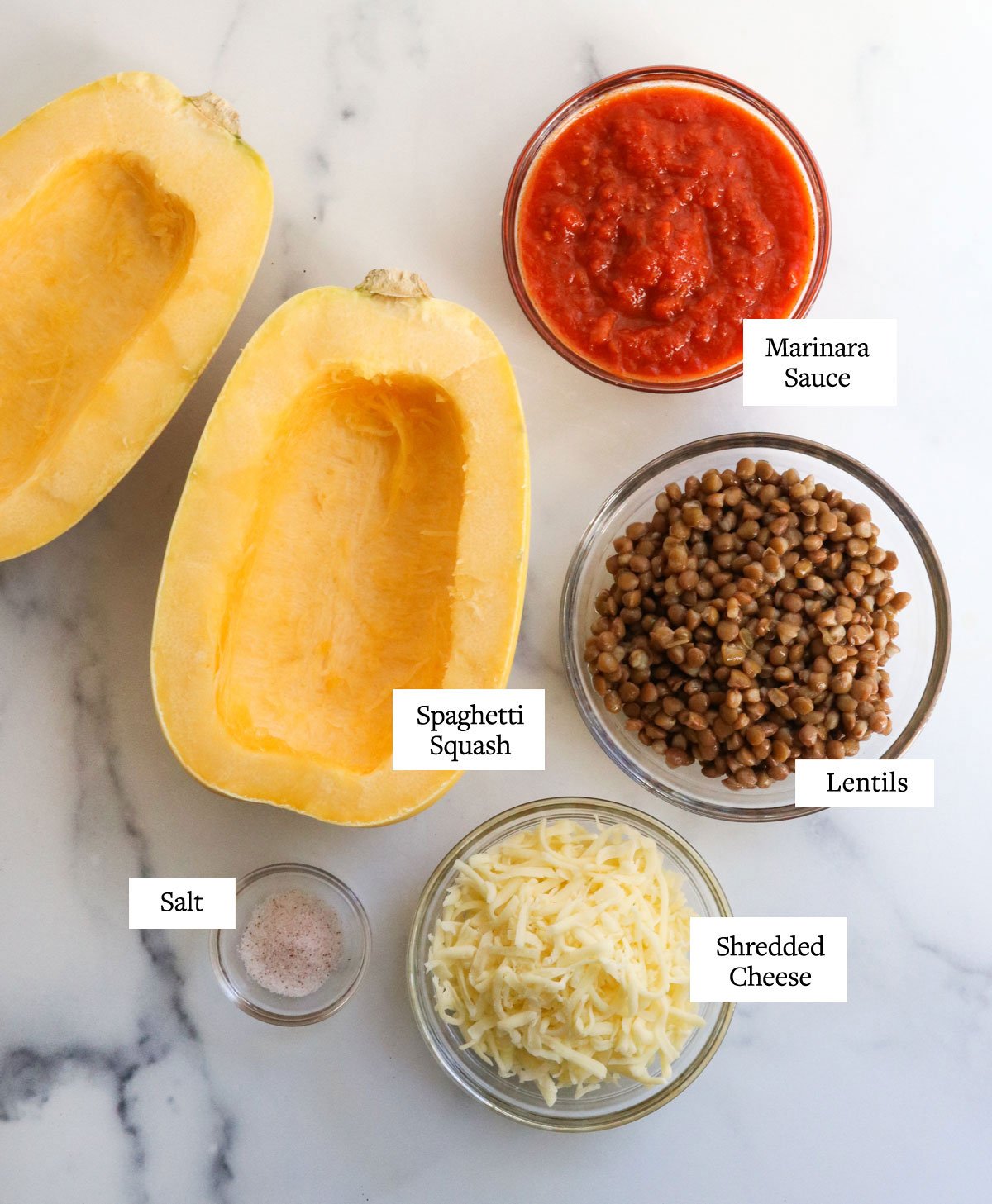 stuffed spaghetti squash ingredients on marble surface