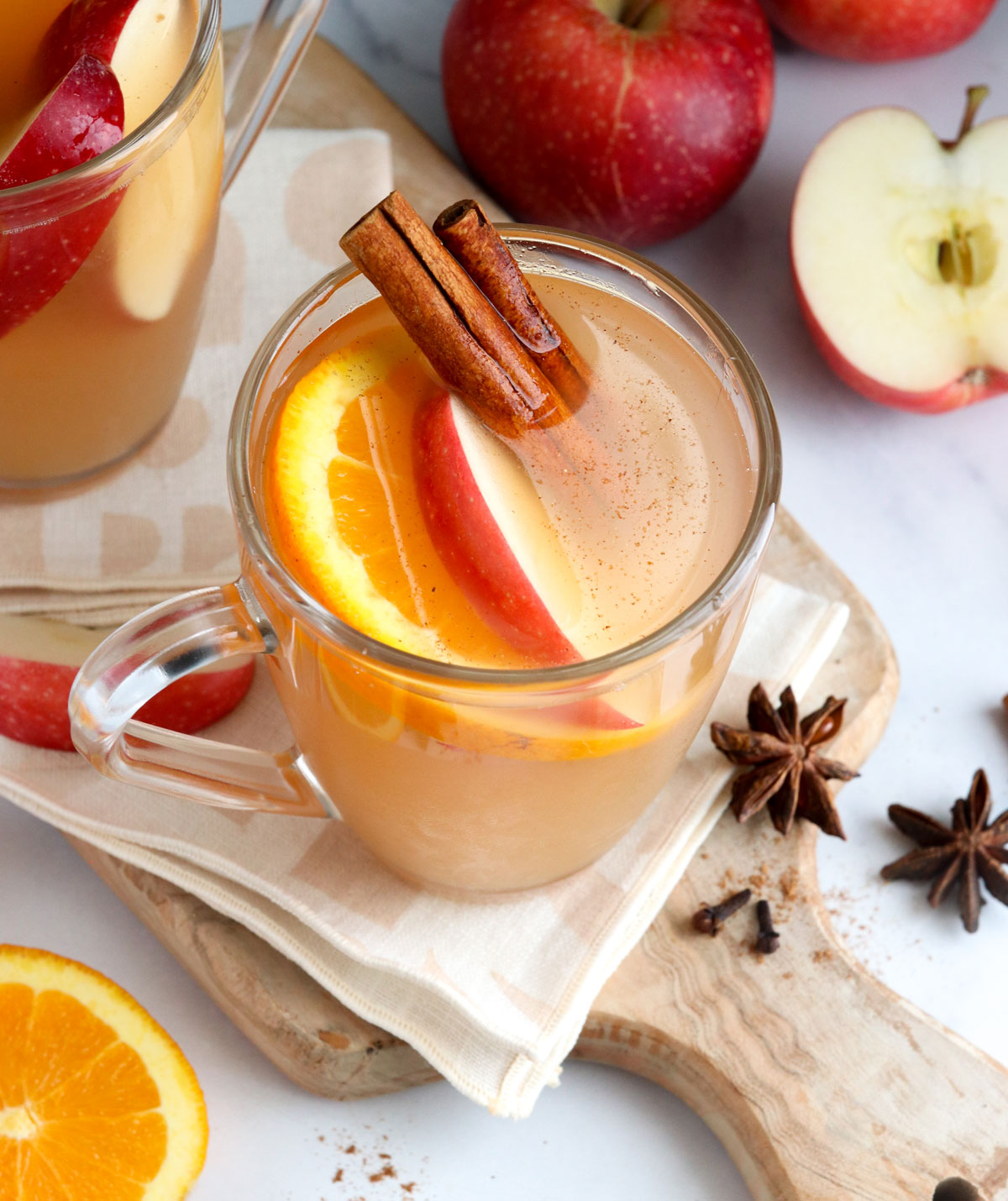 apple cider in glass with cinnamon sticks