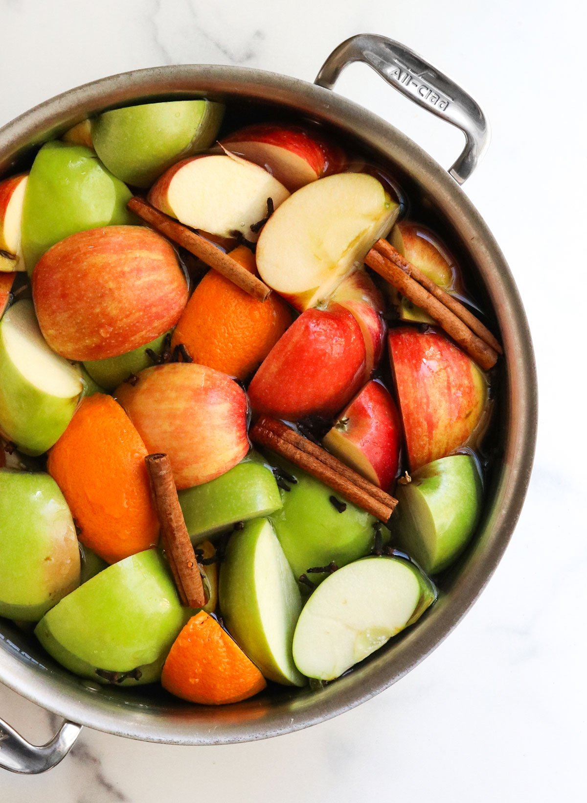 apples and spices in stock pot