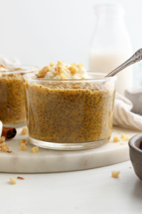 pumpkin chia pudding in glass jar with spoon