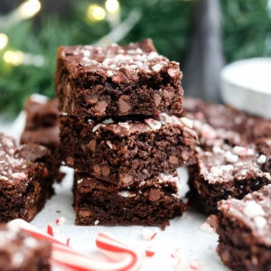 oat flour peppermint brownies stacked in front of garland