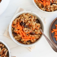 carrot cake oatmeal in 2 bowls with spoons