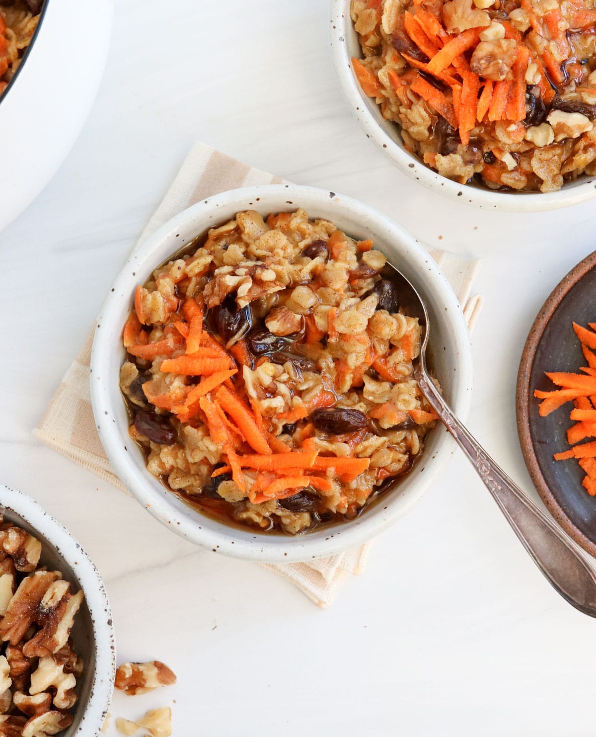 carrot cake oatmeal in 2 bowls with spoons