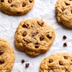 cashew butter cookie closeup on the pan with chocolate chips.