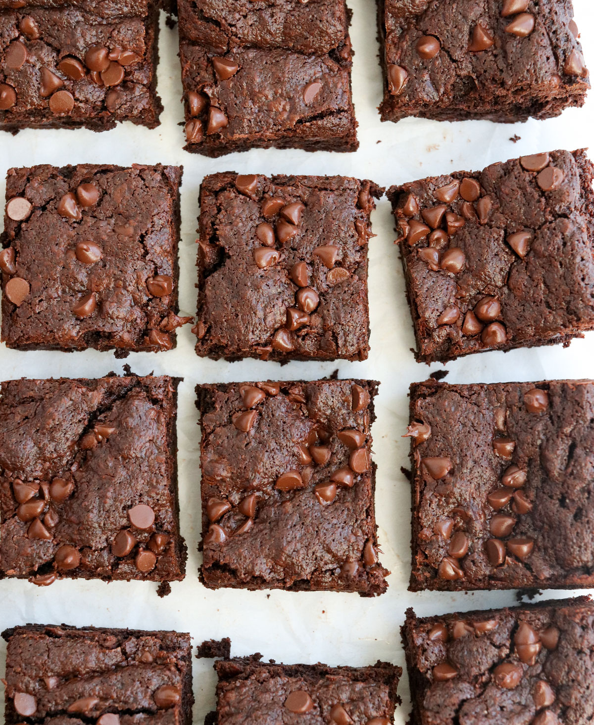 sliced oat flour brownies on parchment paper