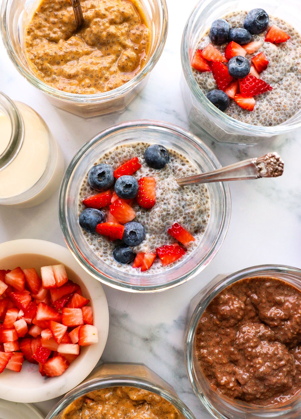 chia pudding topped with berries near a chocolate and pumpkin flavor.