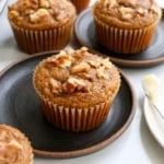 healthy banana muffins with walnuts on top.