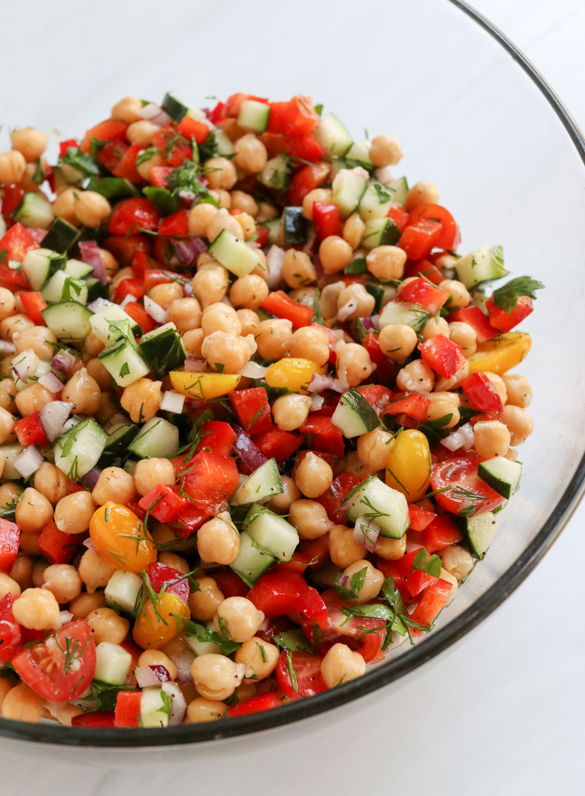 mediterranean chickpea salad mixed in glass bowl