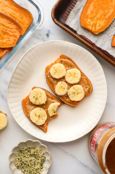 sweet potato toast with a few bites removed on a plate.