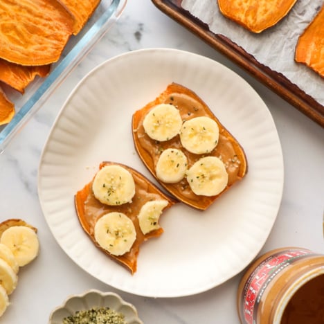 sweet potato toast with a few bites removed on a plate.