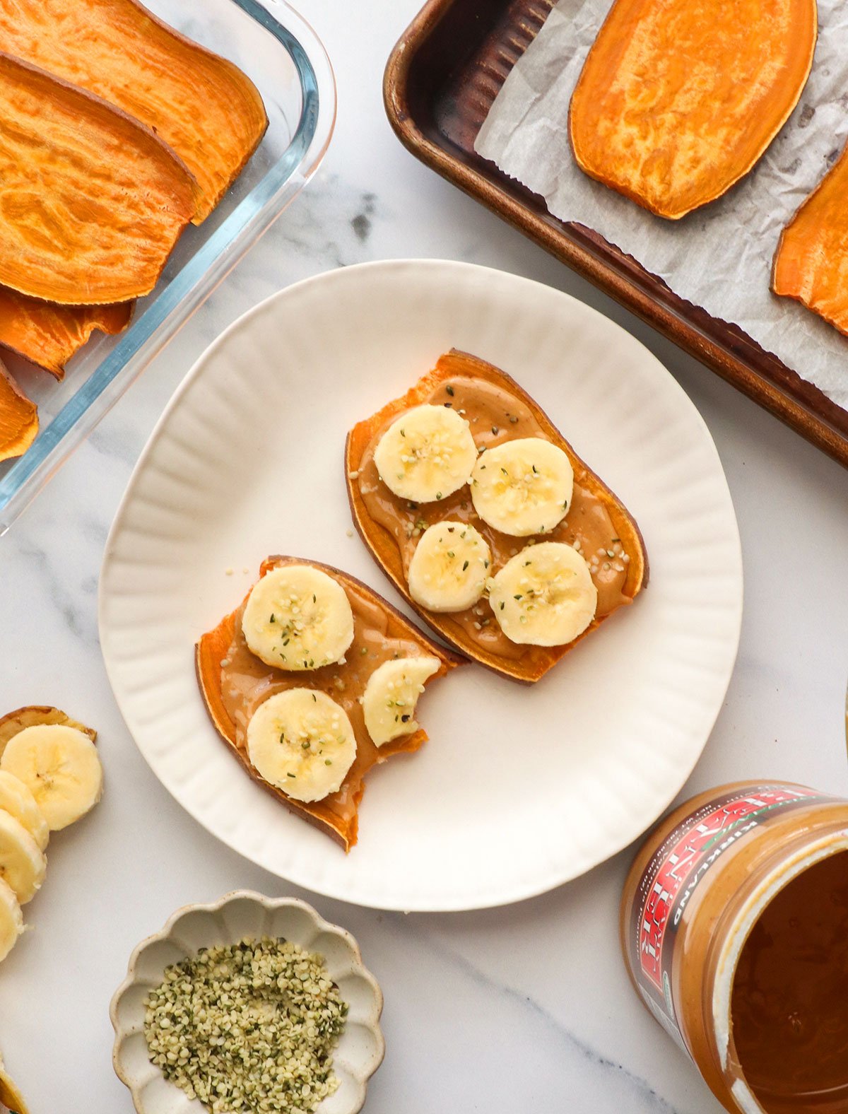 sweet potato toast with a few bites removed on a plate. 