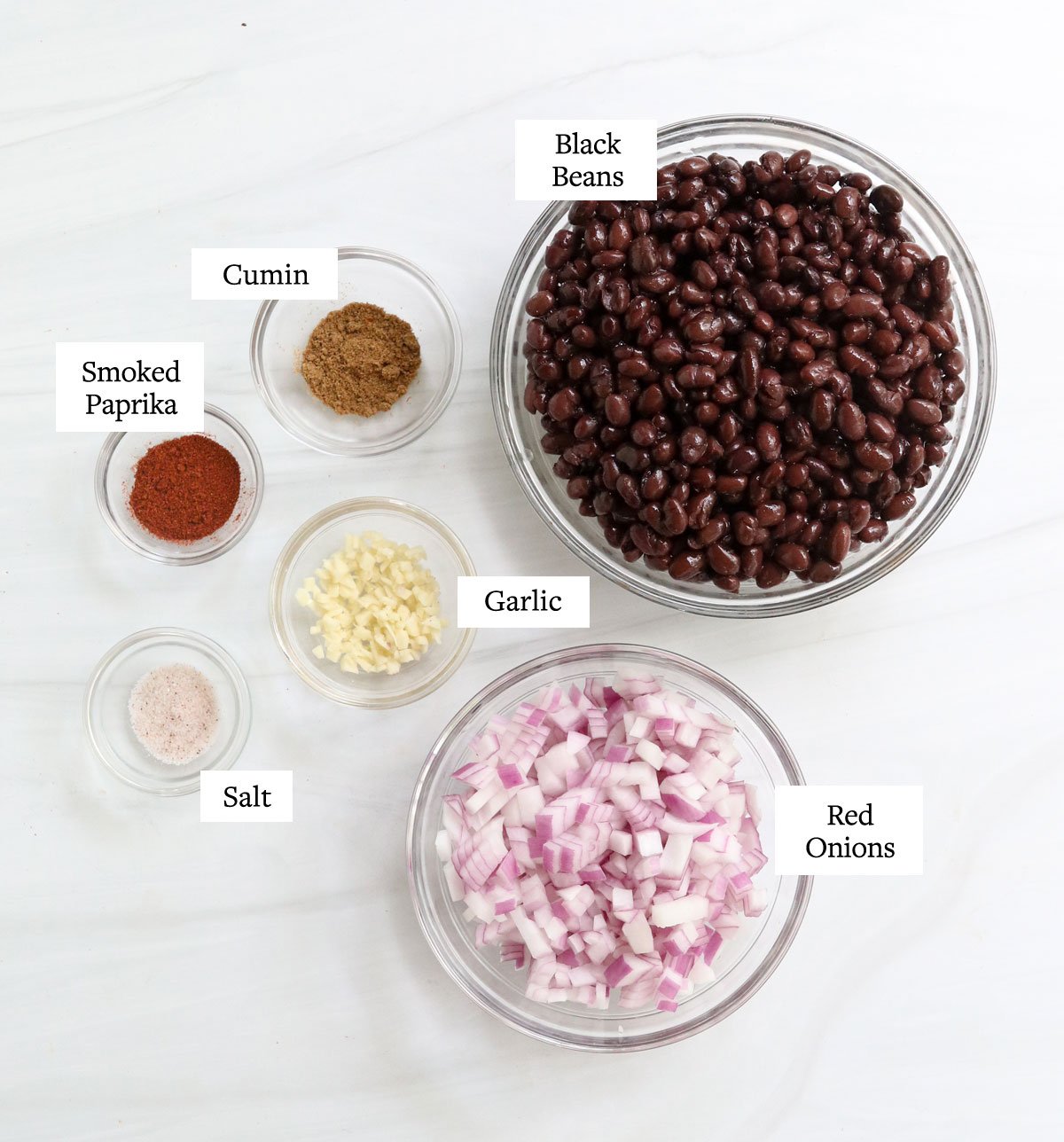 black bean ingredients in glass bowls.