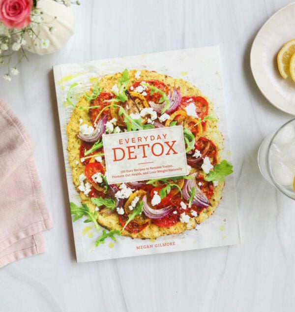 everyday detox book laying on white surface.