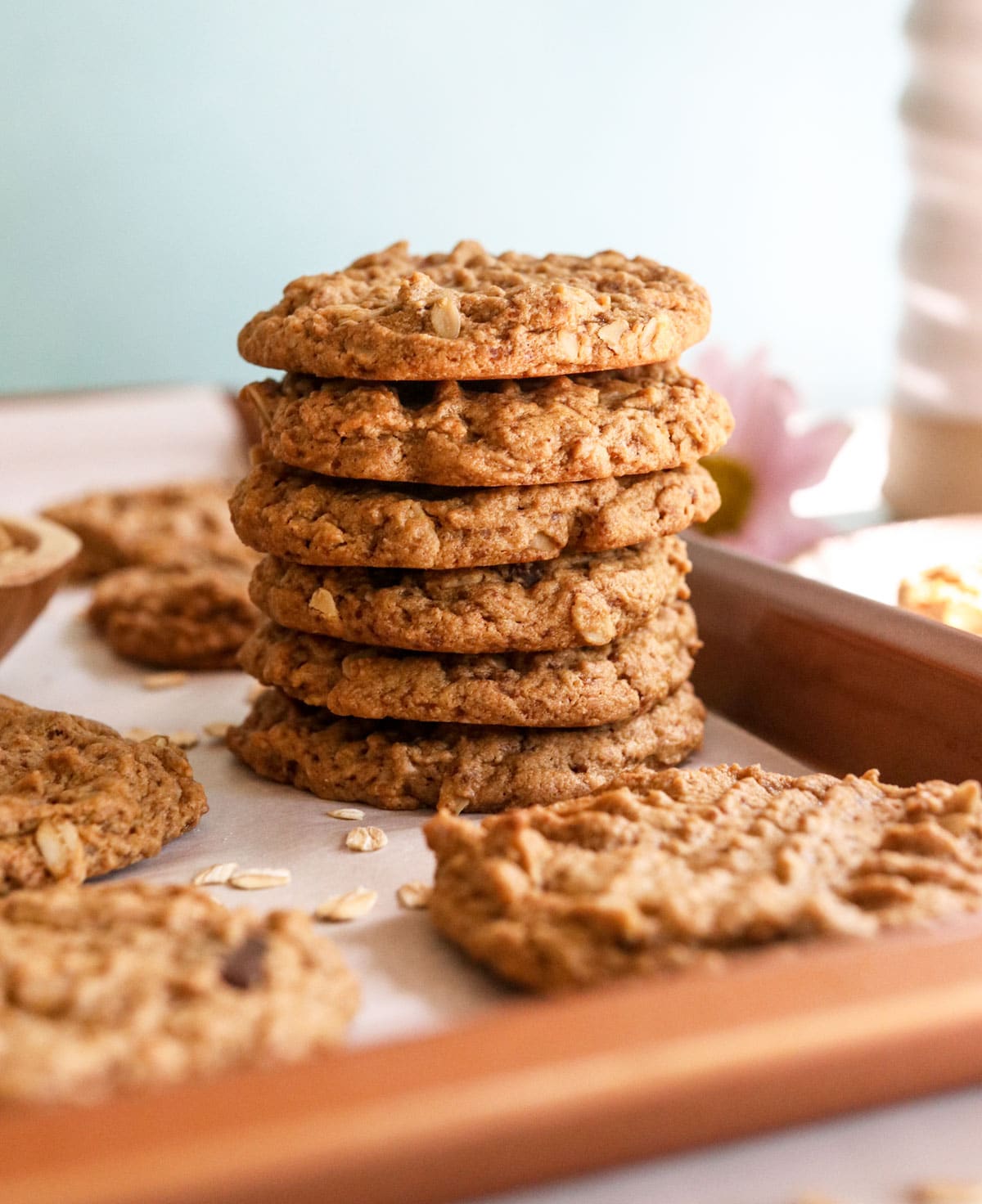 peanut butter oatmeal cookies stacked on pan.