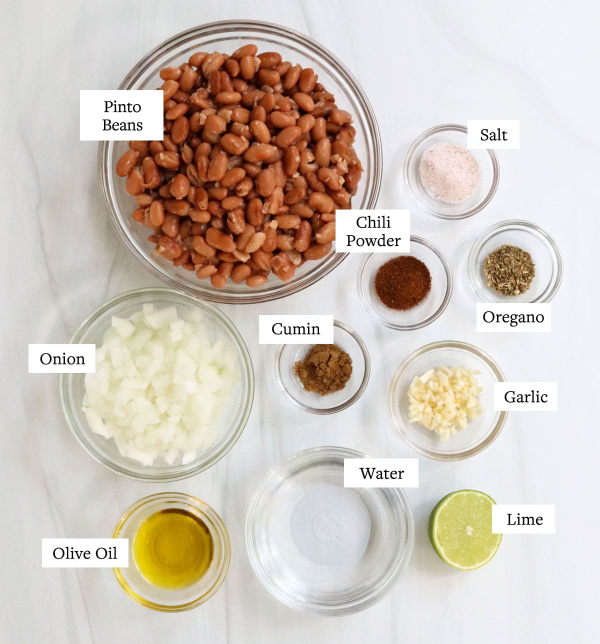 refried bean ingredients labeled on white surface.