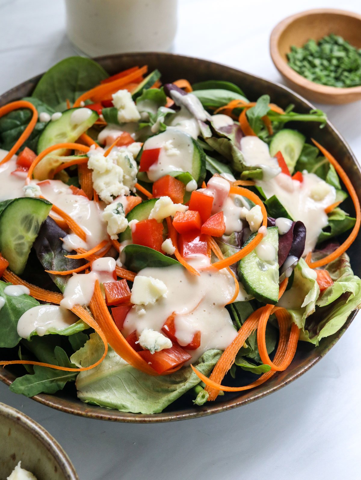 blue cheese dressing served over a green salad.