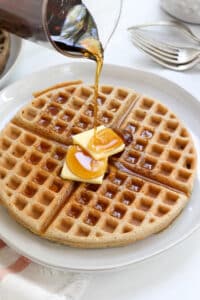 buckwheat waffle with butter and syrup on top.