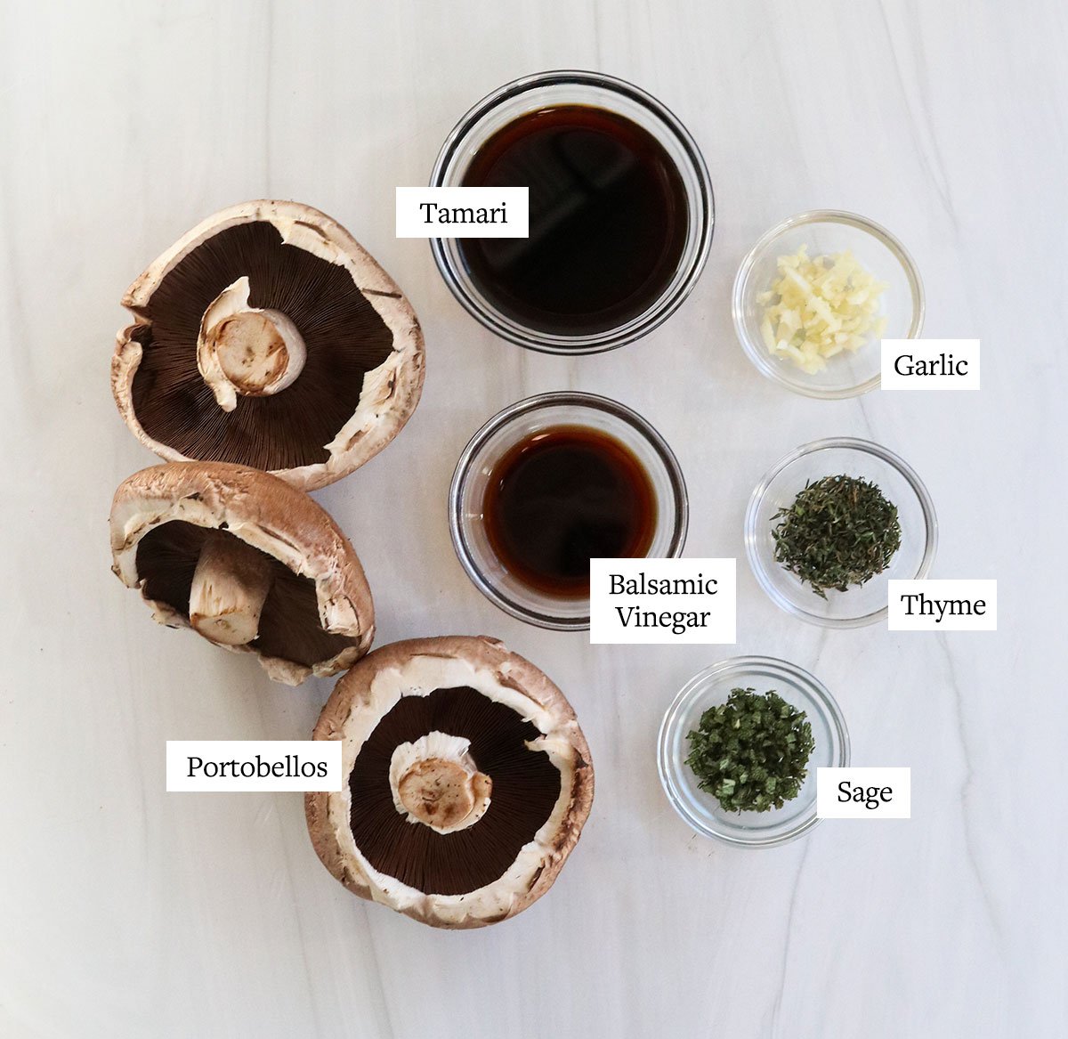 portobello mushroom ingredients labeled in glass bowls.