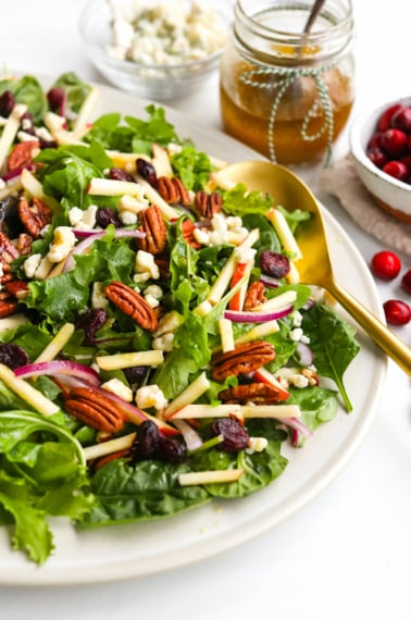 holiday salad topped with apples and pecans.