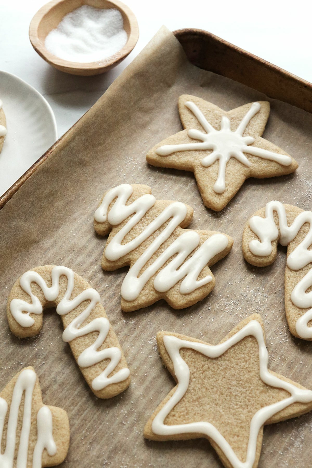 sugar cookies topped with white frosting.