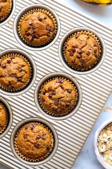 banana oatmeal muffins baked in a silver pan.