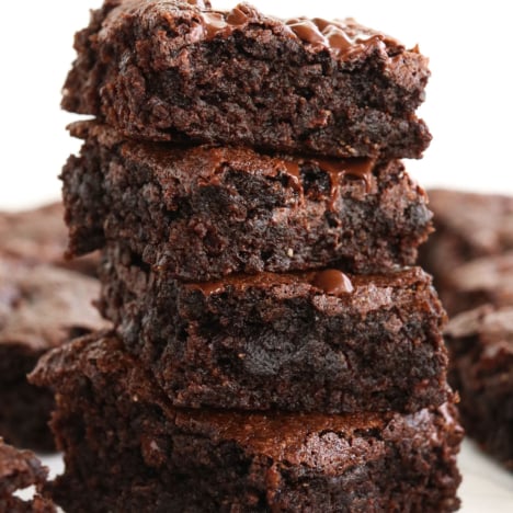 almond flour brownies stacked and close up to show melted chocolate chips.