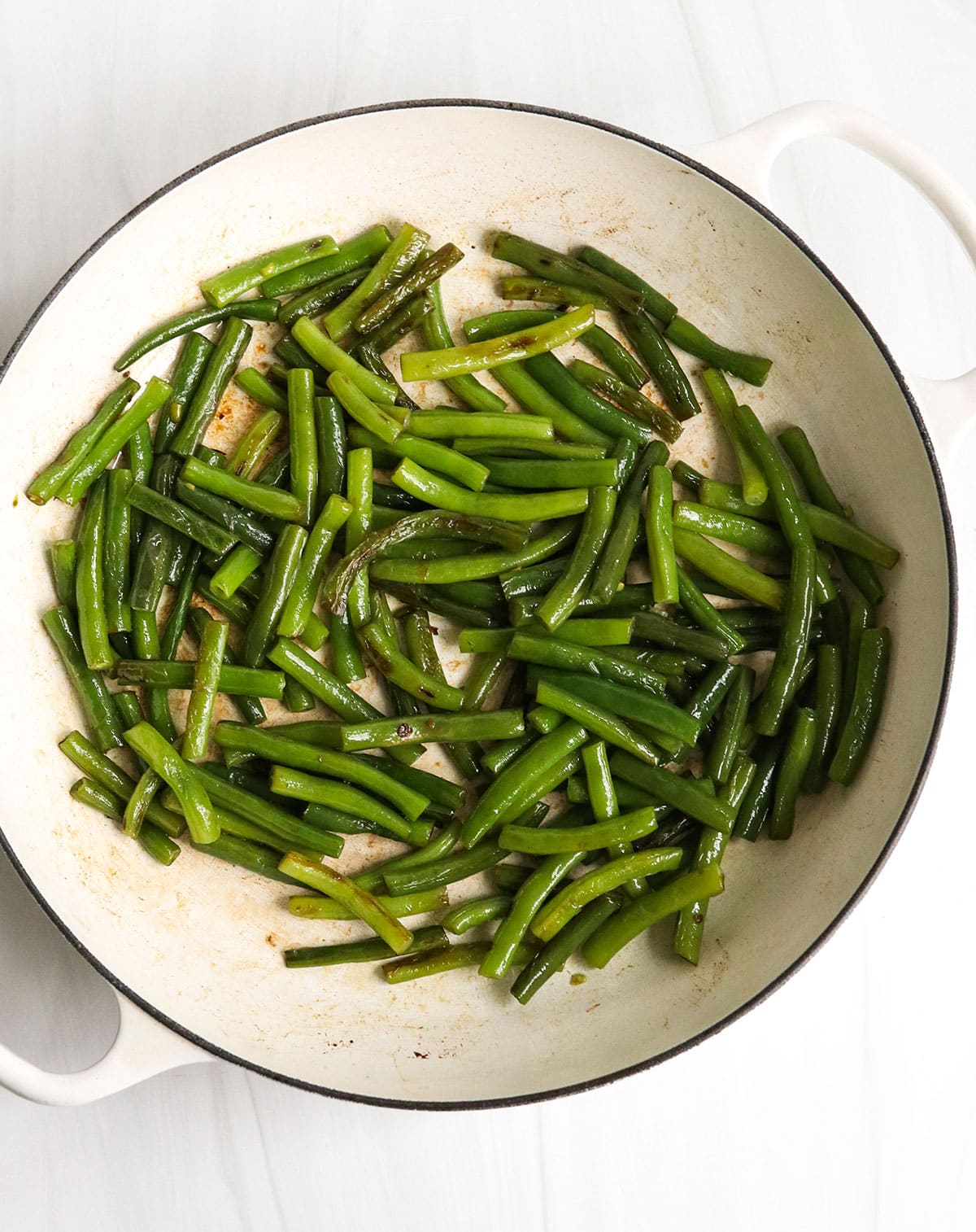 green beans cooked in the large skillet with garlic.