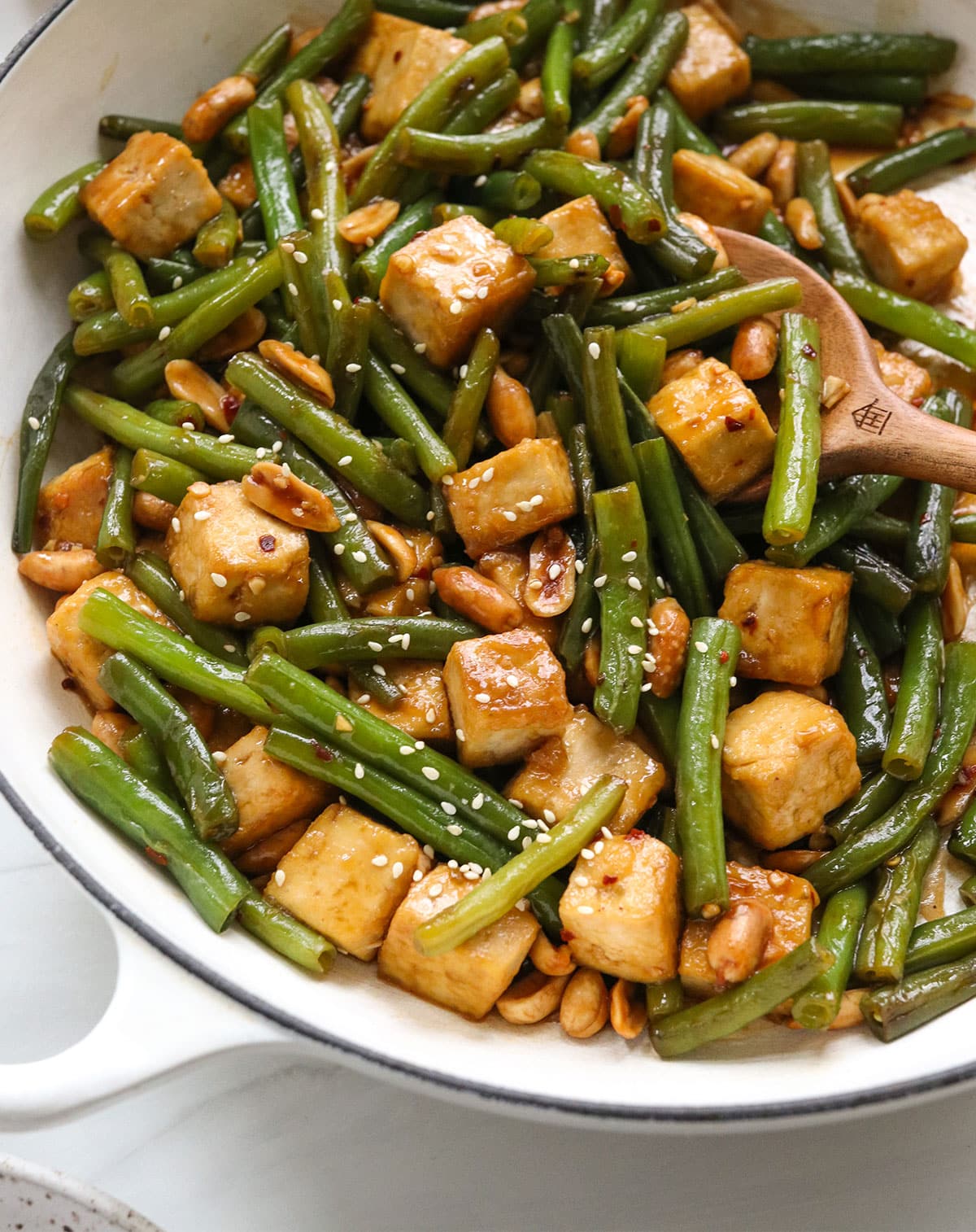 kung pao sauce looking glossy over the veggies and tofu.