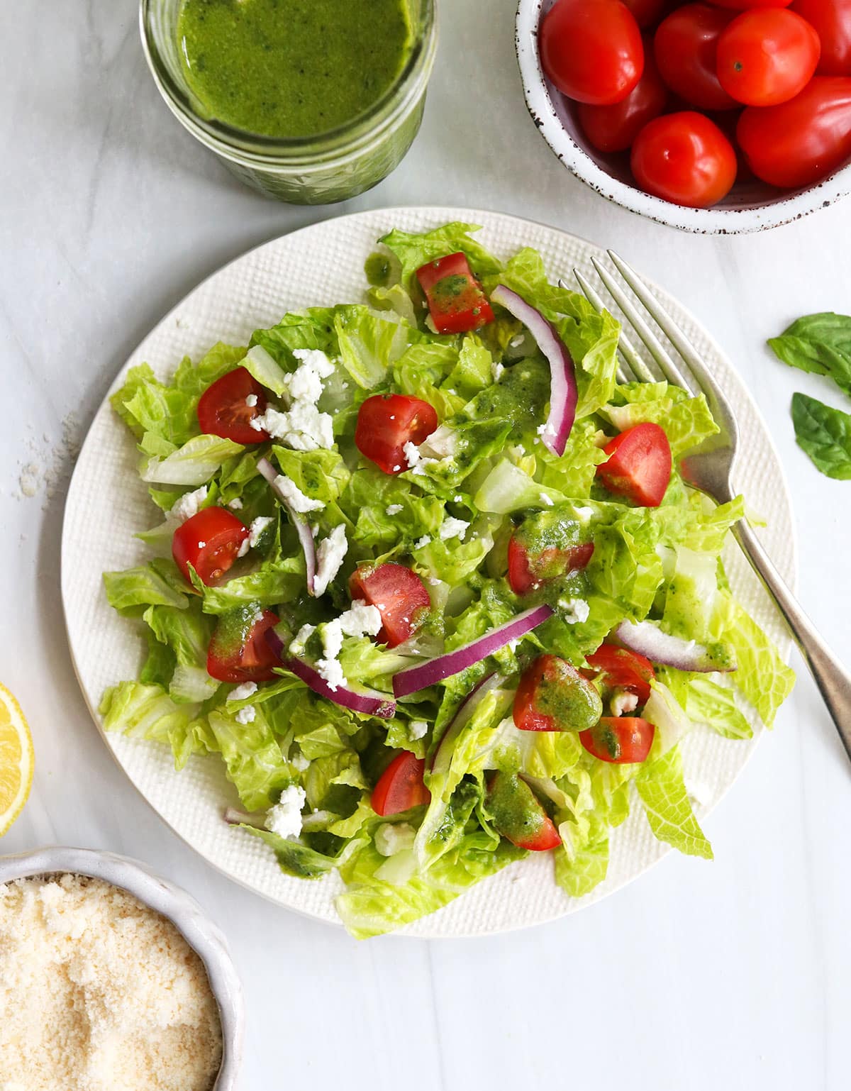 pesto dressing served over romaine lettuce salad.