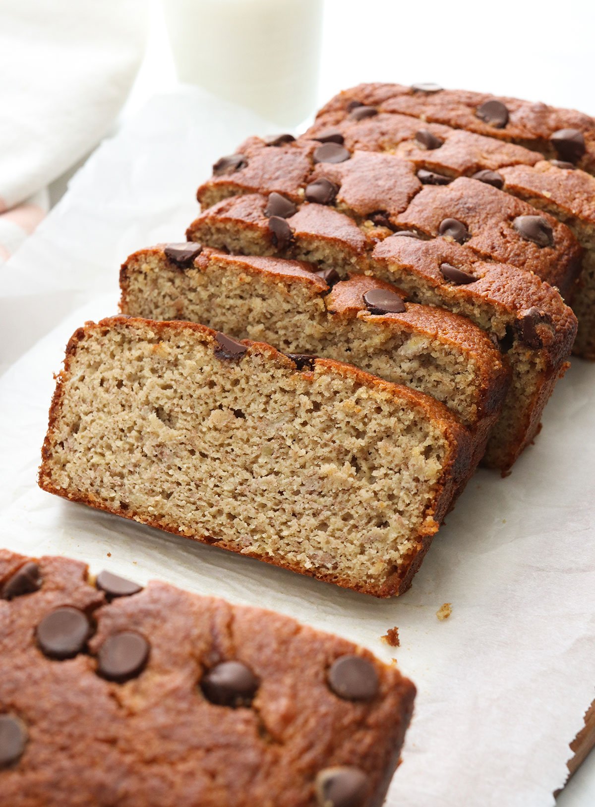 banana bread sliced on parchment paper.