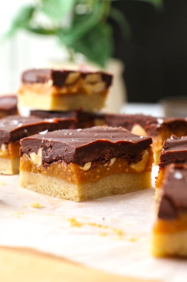 Close-up of a healthy snickers bar to show the layers of caramel, chocolate, and peanuts.