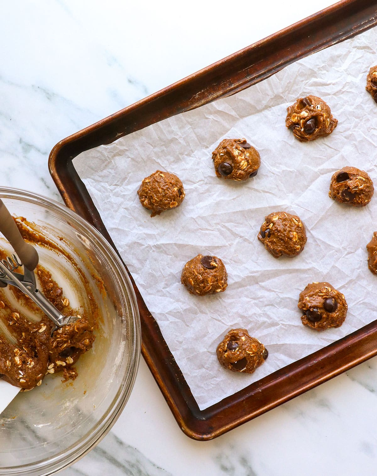 lactation cookie dough dropped onto a lined pan.