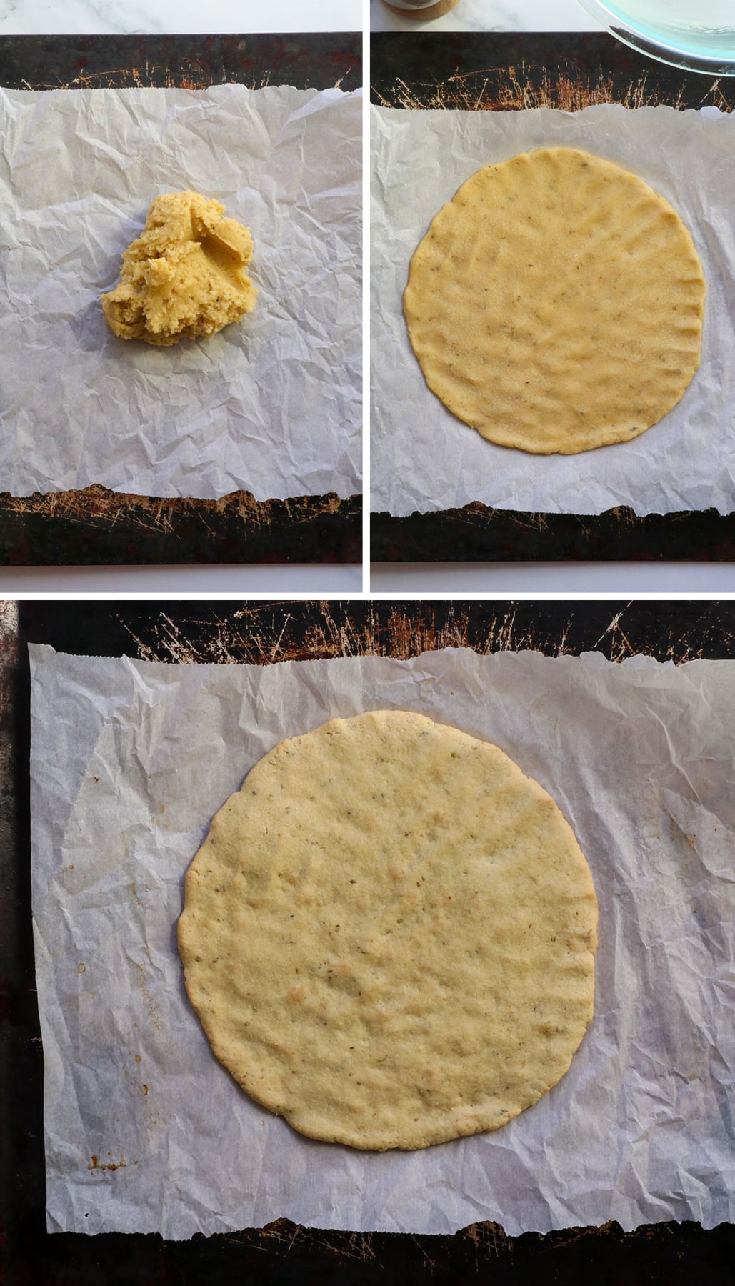 almond flour pizza dough flattened on a baking sheet.