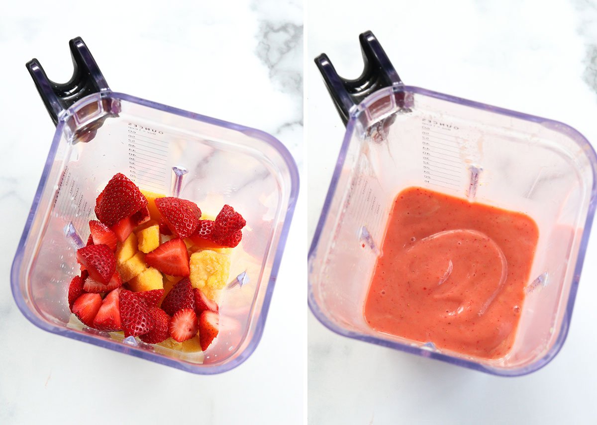 strawberries and mangoes blended together in a blender pitcher.