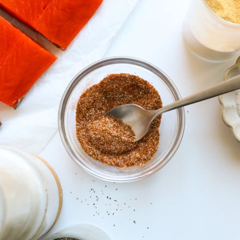 salmon seasoning stirred in a glass bowl.