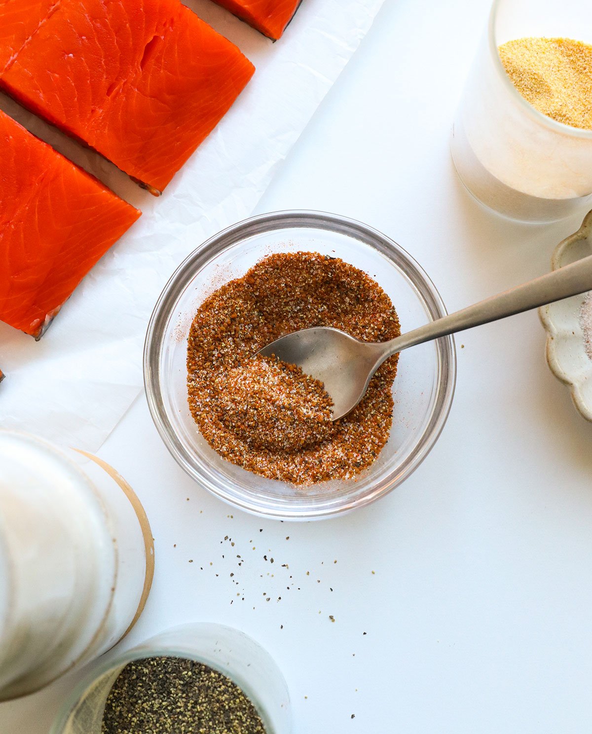 salmon seasoning stirred in a glass bowl.