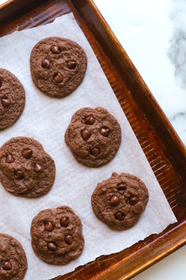 chocolate buckwheat cookies cooling on a baking sheet.