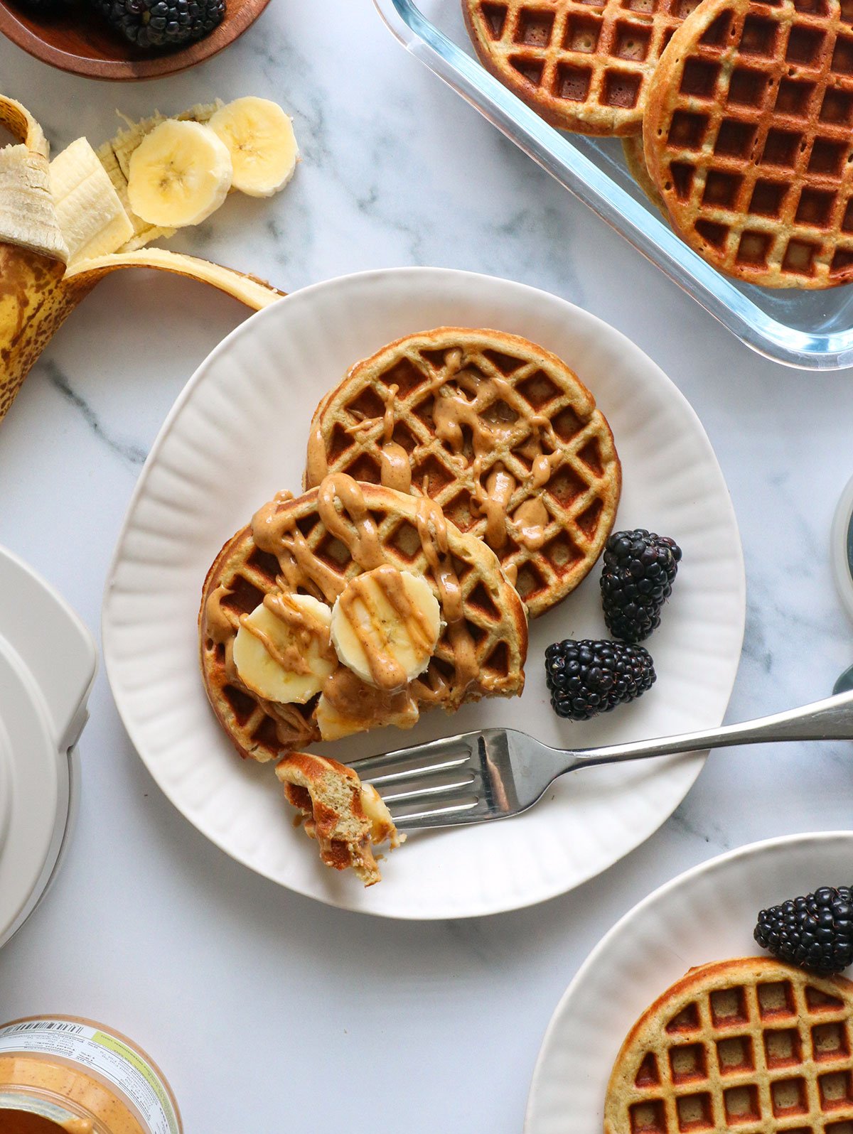 protein waffles topped with banana and peanut butter.