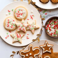 gluten free sugar cookies and gingerbread cookies on plates.