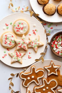 gluten free sugar cookies and gingerbread cookies on plates.