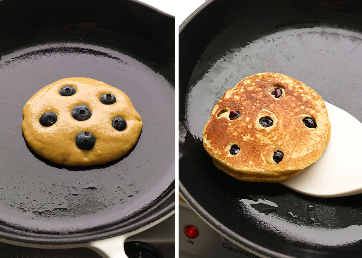 blueberry protein pancakes flipped in a skillet.