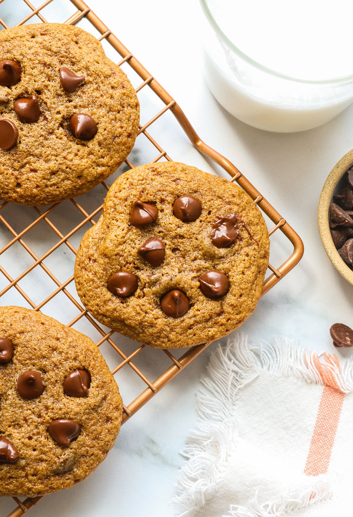 oat flour chocolate chip cookie on a rack. 