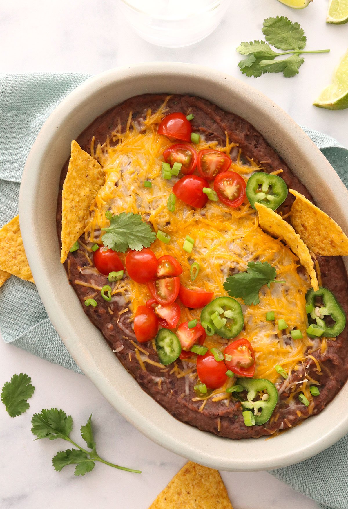 black bean dip served warm with cheese melted on top.