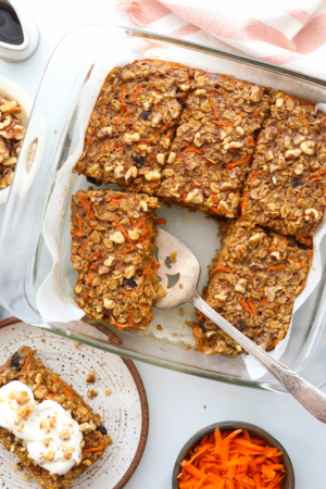 carrot cake baked oatmeal sliced and served from the pan.