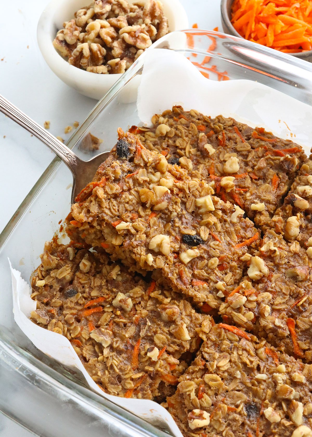 baked carrot cake oatmeal sliced into 6 large pieces and lifted out of pan.