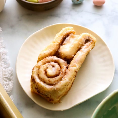 bunny cinnamon roll on a white plate.