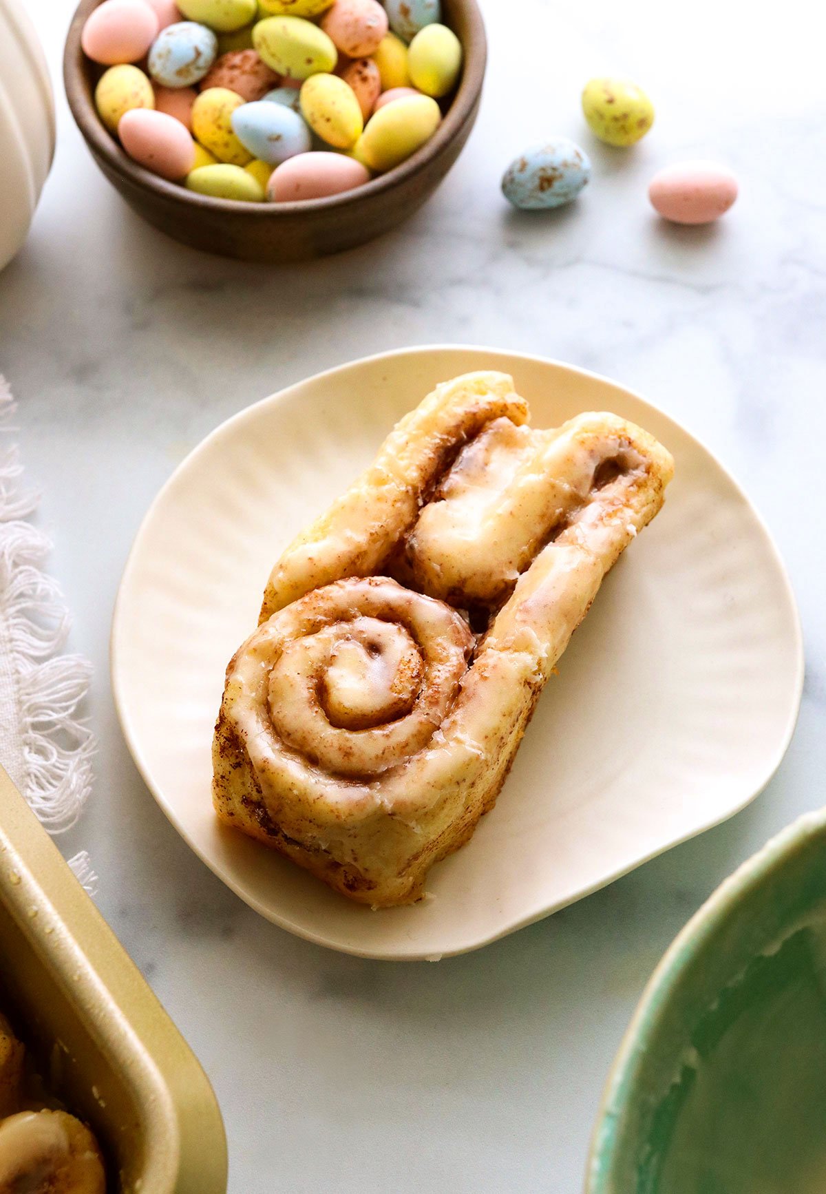 bunny cinnamon roll on a white plate.