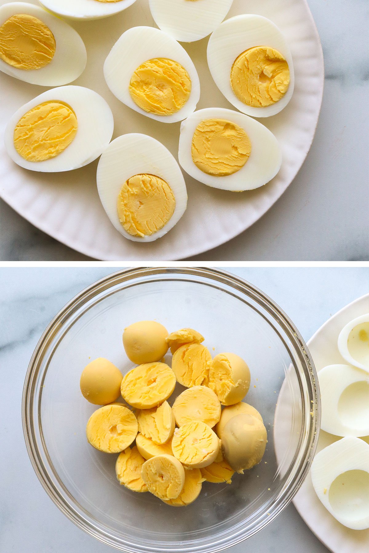 hard boiled eggs sliced and yolks added to a glass bowl.