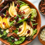 pear salad topped with cranberries, pecans, and gorgonzola.